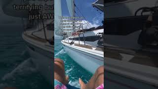 Sailor hanging out over the sea in hammock chair