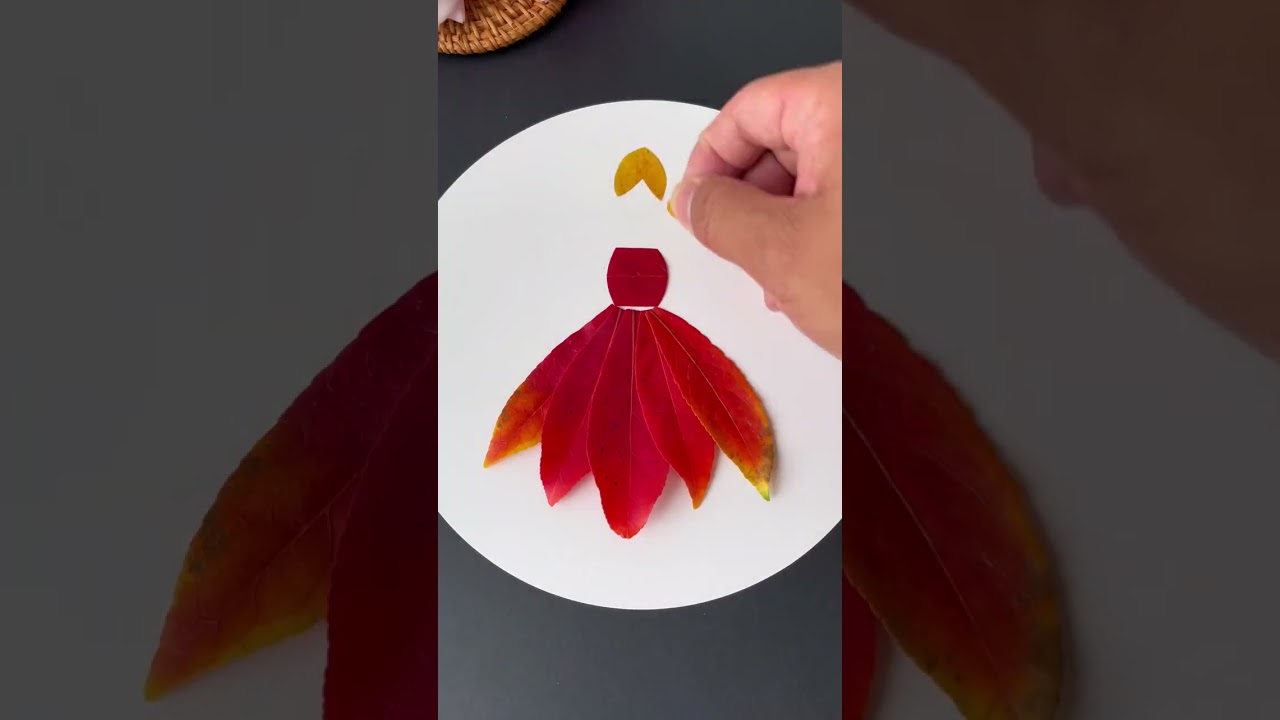Use autumn red fallen leaves to collage a beautiful little princess. Leaf stickers. Leaf painting k