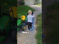 Little Boy Tows His Toy Car With His Tractor