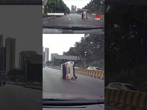 Water puddle causes car to skid, overturn on Malaysian highway