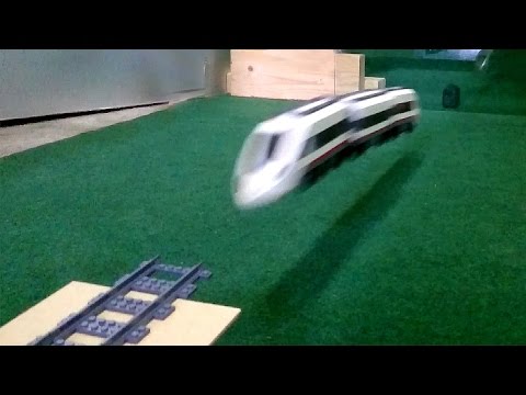 Lego train crashing onto glass