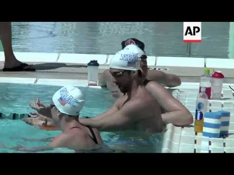 A giddy Michael Phelps qualified fastest for the 100-meter butterfly final Thursday in his first com
