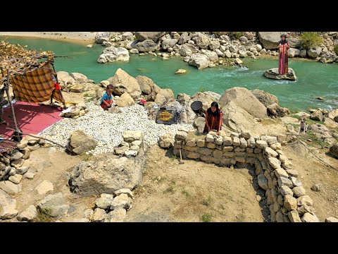 A lonely woman by a wild river in Iran: Building a shelter with rocks and mud in theZagros Mountains