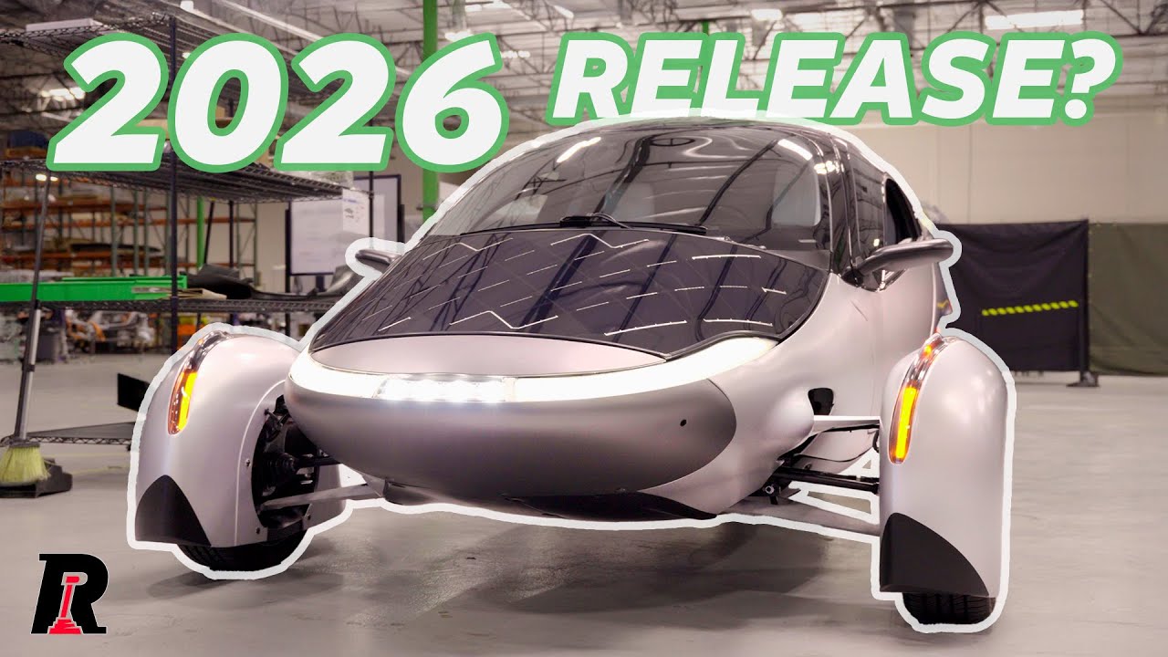 Aptera three-wheeled solar electric vehicle on the factory floor at Carlsbad California showing the carbon fiber SMC body panels and solar roof