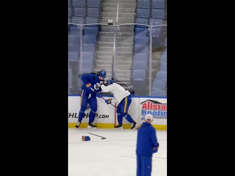 Peyton Krebs and Owen Power face off at the end of Sabres practice