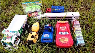Looking for toy cars in the garden