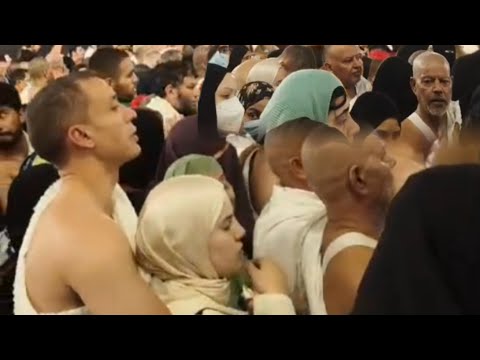 Crowd of people performing Tawaf (circumambulation) around Mecca