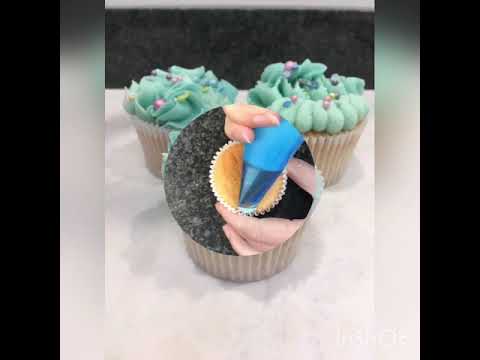 Buttercream piping cupcakes with mermaid colour way...
