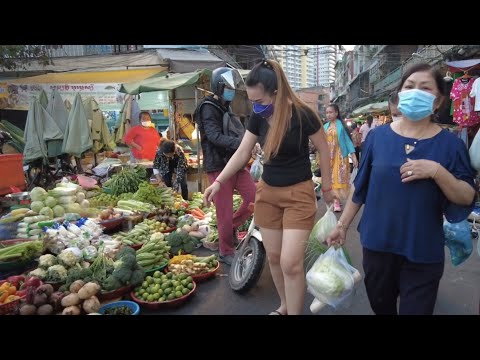 Everyday life in Phnom Penh traditional market | People activities shopping view