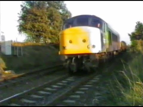 45049 passes Daw Mill with a rake of car flats