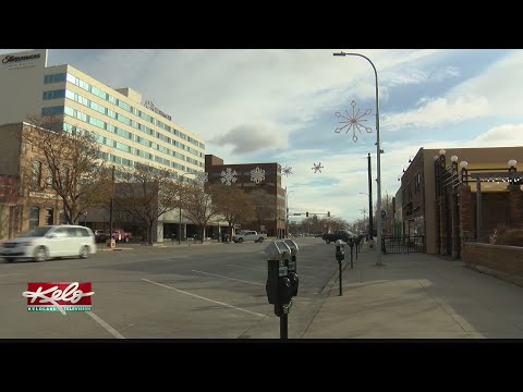 Winter gear placed on statues in Rapid City to help the homeless