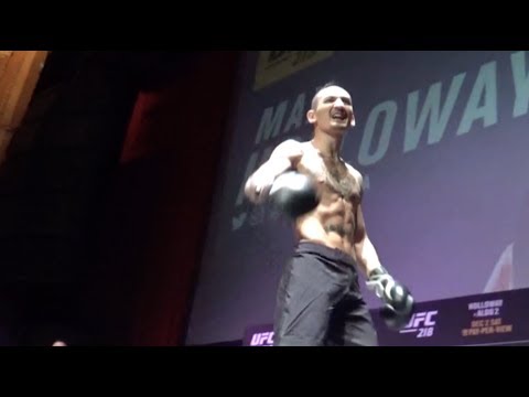 Max Holloway brings fan onto stage at the UFC 218 open workouts