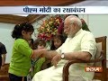 Children tie Rakhi to PM Narendra Modi on the occasion of Raksha Bandhan