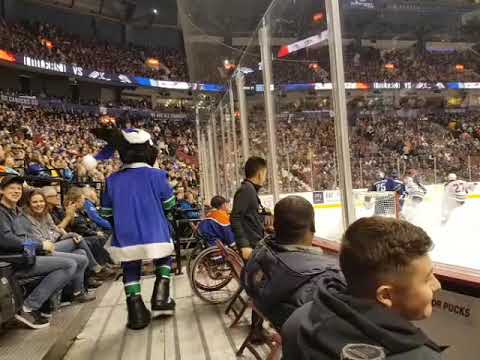 Fin Canucks mascot messing with senior's hair