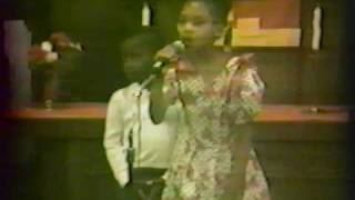 Jamela Bullock sings at church in 1989 with her brother