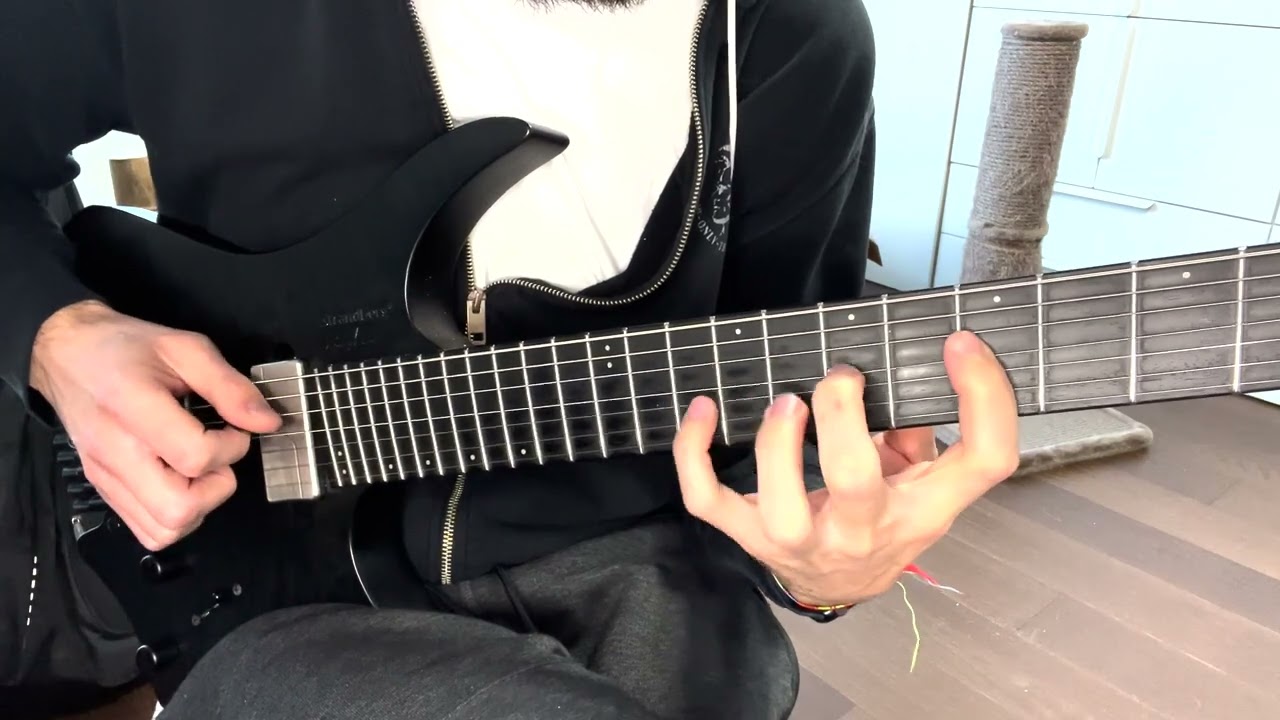 Guitarist playing the same note on different strings across the fretboard for a unison lick.