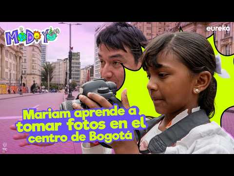Guiada por Adner, Mariam recorre por primera vez el centro de Bogotá y, mientras aprende a capturar edificios, calles, personas y colores con su cámara, 