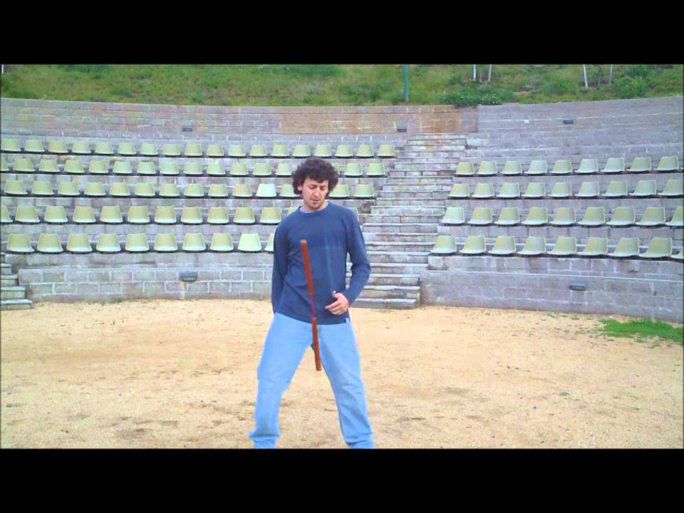 Nunchaku trick: between the legs aerial to other hand