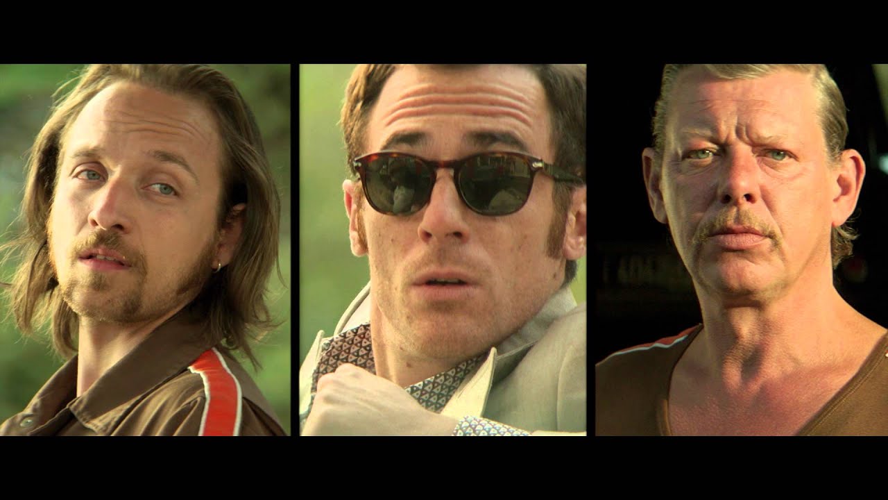 The Lady in the Car with Glasses and a Gun Clip - Gas