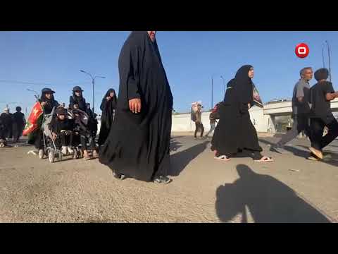 شاهد بالفيديو.. مشاية زوار الامام الحسين علية السلام طريق بغداد كربلاء