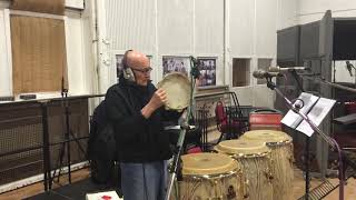 Ray Cooper plays the tambourine.