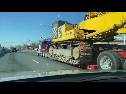 Heavy Haul Trucker Transporting A Huge Komatsu PC800LC Excavator