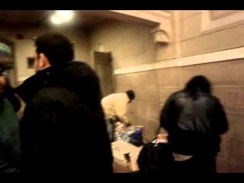 Saigon handing out blankets in Bowery Mission homeless shelter in NYC 2011