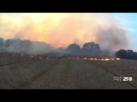 Firefighters continue to battle fire on the edge of Lake Somerville