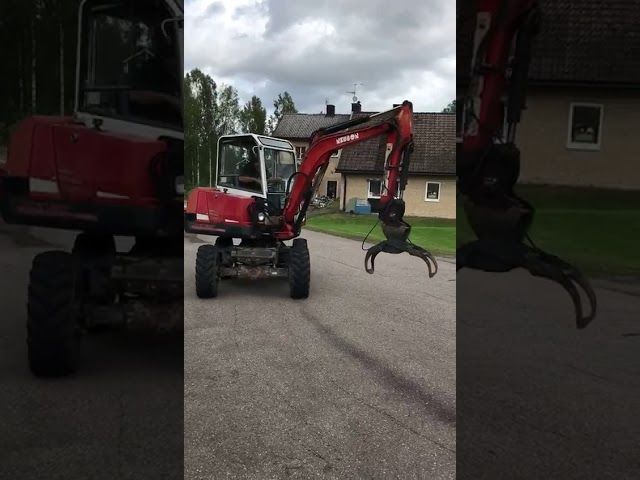 591263 Neuson 3800 WD SLR wheeled excavator with implements