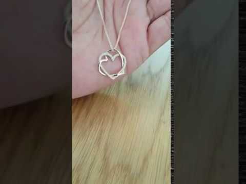 A video of Unique Heart in Heart Diamond Pendant