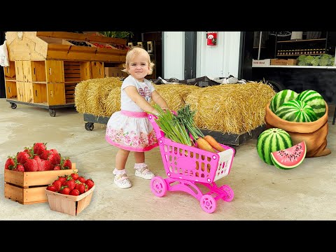 Alice and Mom learn how to harvest strawberries and vegetables at the farm