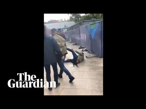 Tommy Robinson filmed punching man outside England match in Portugal
