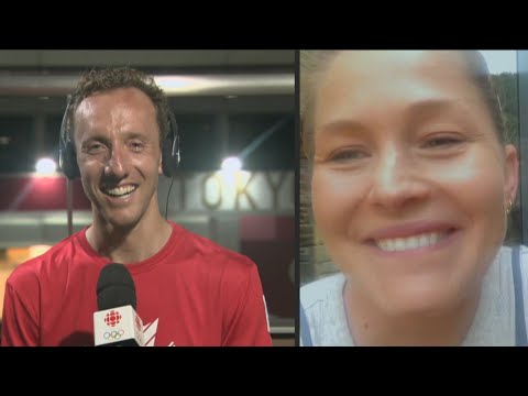Cyclist Michael Woods surprised by wife Elly on TV after race