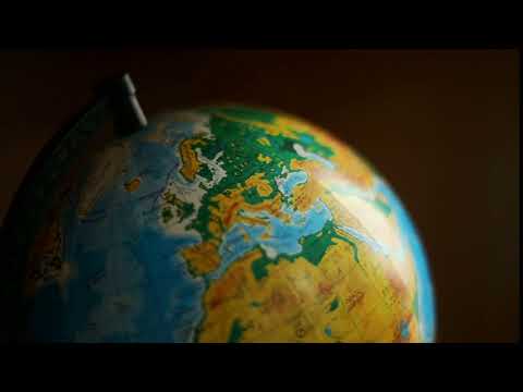 twisting globe on a dark background in school it comes out