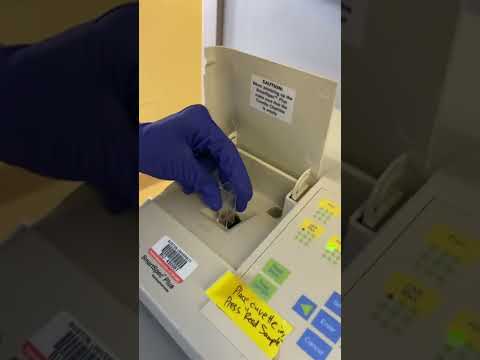 Loading a cuvette into a spectrophotometer