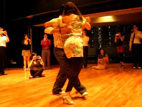  Roxana Suarez  and  Sebastian Achaval  are  dancing  to  the  tango  "  Mandria  "