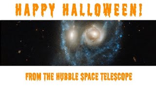 Spooky Halloween 'Face' Formed by Titanic Smashup Between Two Galaxies