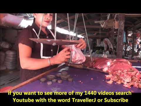 A lady meat seller in Thandwe Market, Myanmar