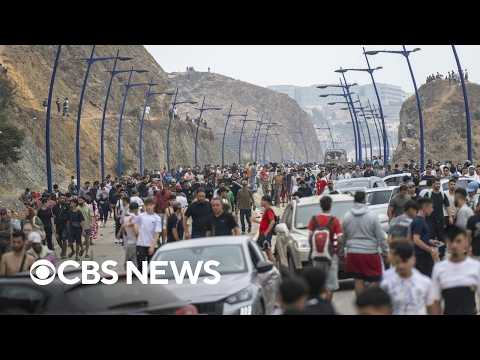 Stunning video shows migrants crossing Spain's border with Morocco