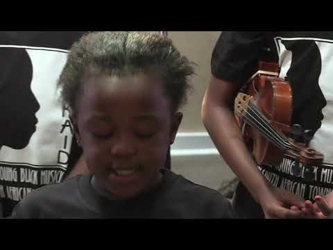 Buskaid plays and sings the Anthem