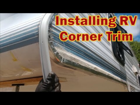 The final step, installing RV corner trim on truck camper.