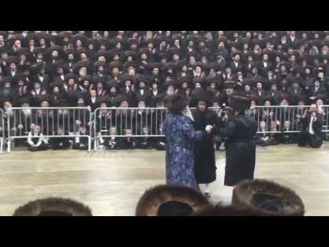 Bobov rebbe dancing with his eldest son and grandchild at the grand Bobov wedding