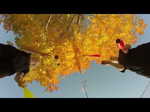 Juggler Duo Performs Impressive Pass Juggling Trick During Autumn Season - 1217888-3
