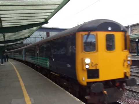 The Class 37 BR Large Logo Blue No.37403 with ‘Northern Cumbrian Coast Train’ departs at Carlisle.