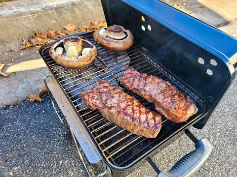 Juicy Strip steak on weber go anywhere charcoal