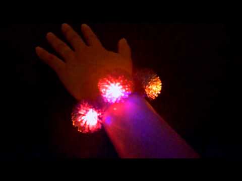 rebeccas.com - Flashing Triple Pom Pom Bracelet