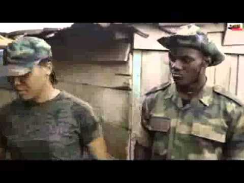 A soldier asking a warri boy questions