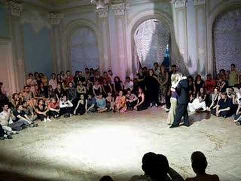  Ramiro Gigliotti  and  Irina Petritchenko  are  dancing  to  a  tango