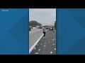 Cash on San Diego freeway | Traffic incident with armored vehicle causes chaos on Interstate 5