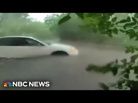 Officers rescue infant from flooded car in Texas as storms snarl holiday travel